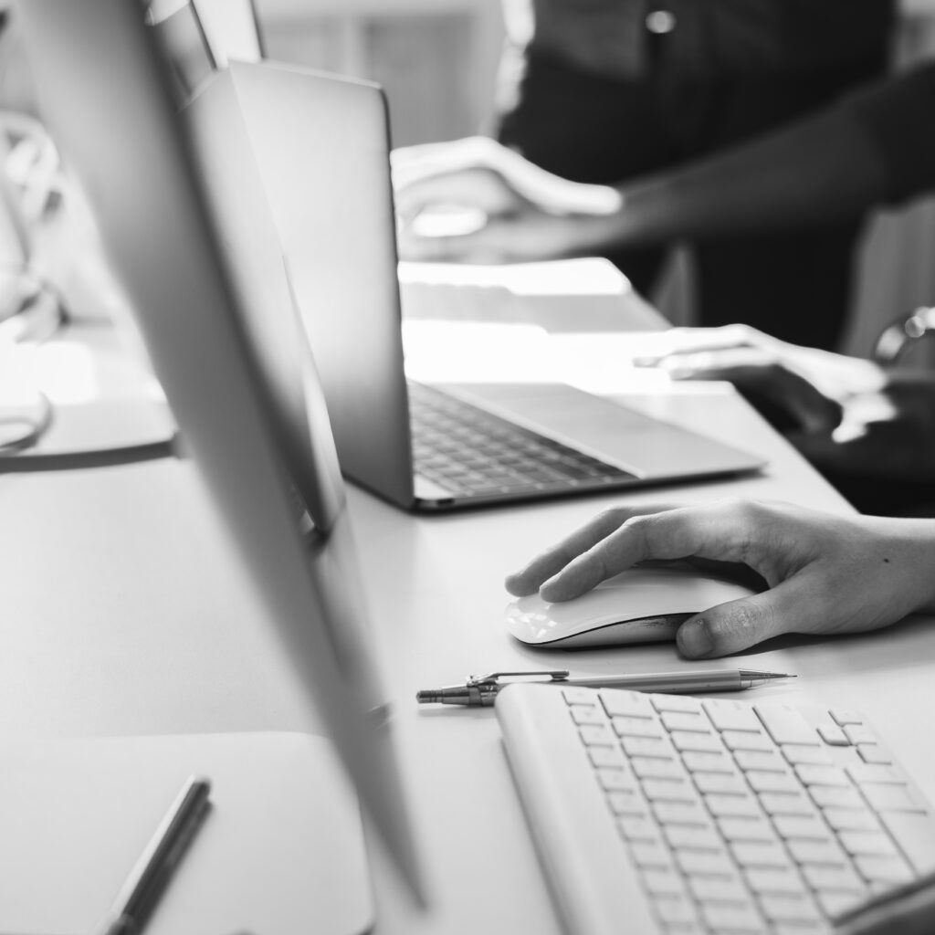 Close up of people's hands working on computers